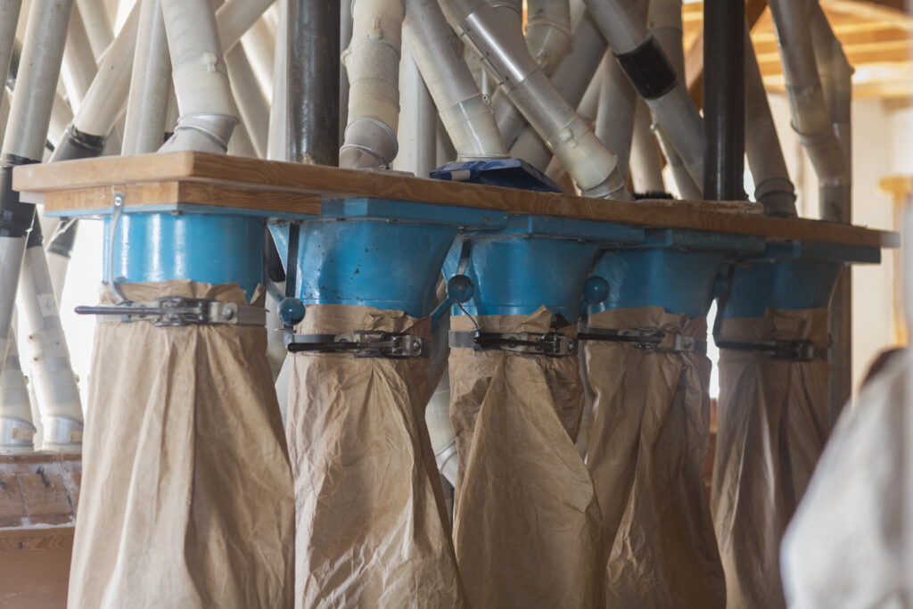 The current image has no alternative text. The file name is: milling-machine-with-pipes-and-flour-sacks-at-whea-2026-01-09-09-23-18-utc-scaled.jpg